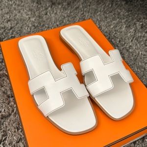 Hermes oran sandals in white